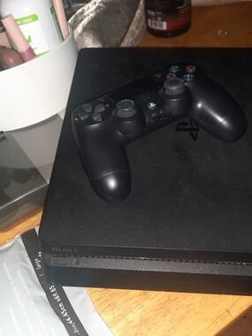Sony PlayStation 4 Slim Console with Black DualShock 4 Wireless Controller
